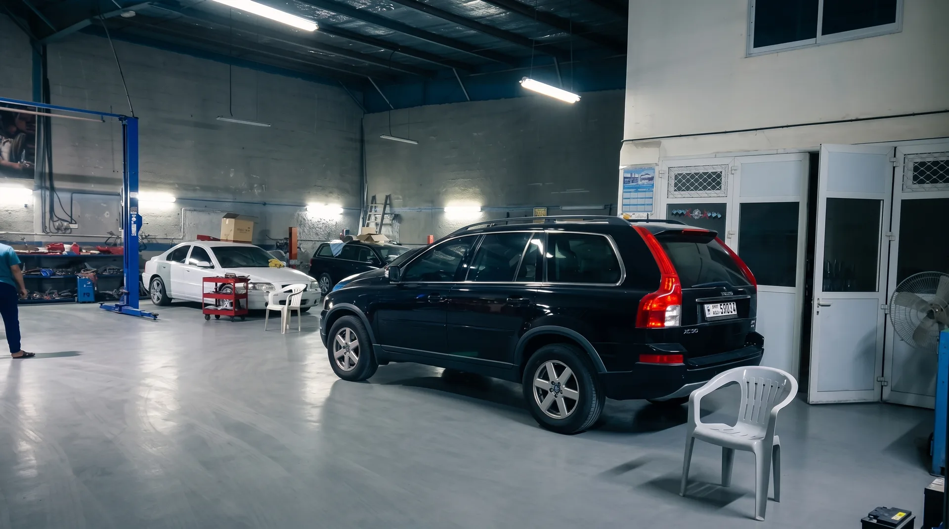 Service bay with Volvo estate under diagnosis